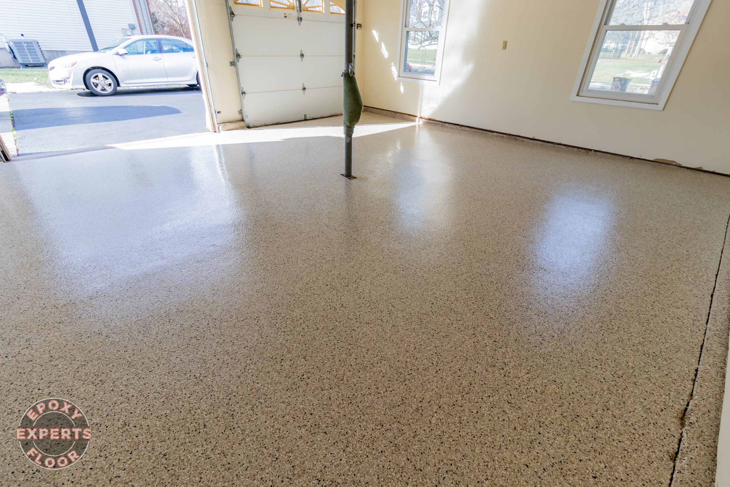 Garage with epoxy flooring on old concrete by the epoxy floor experts