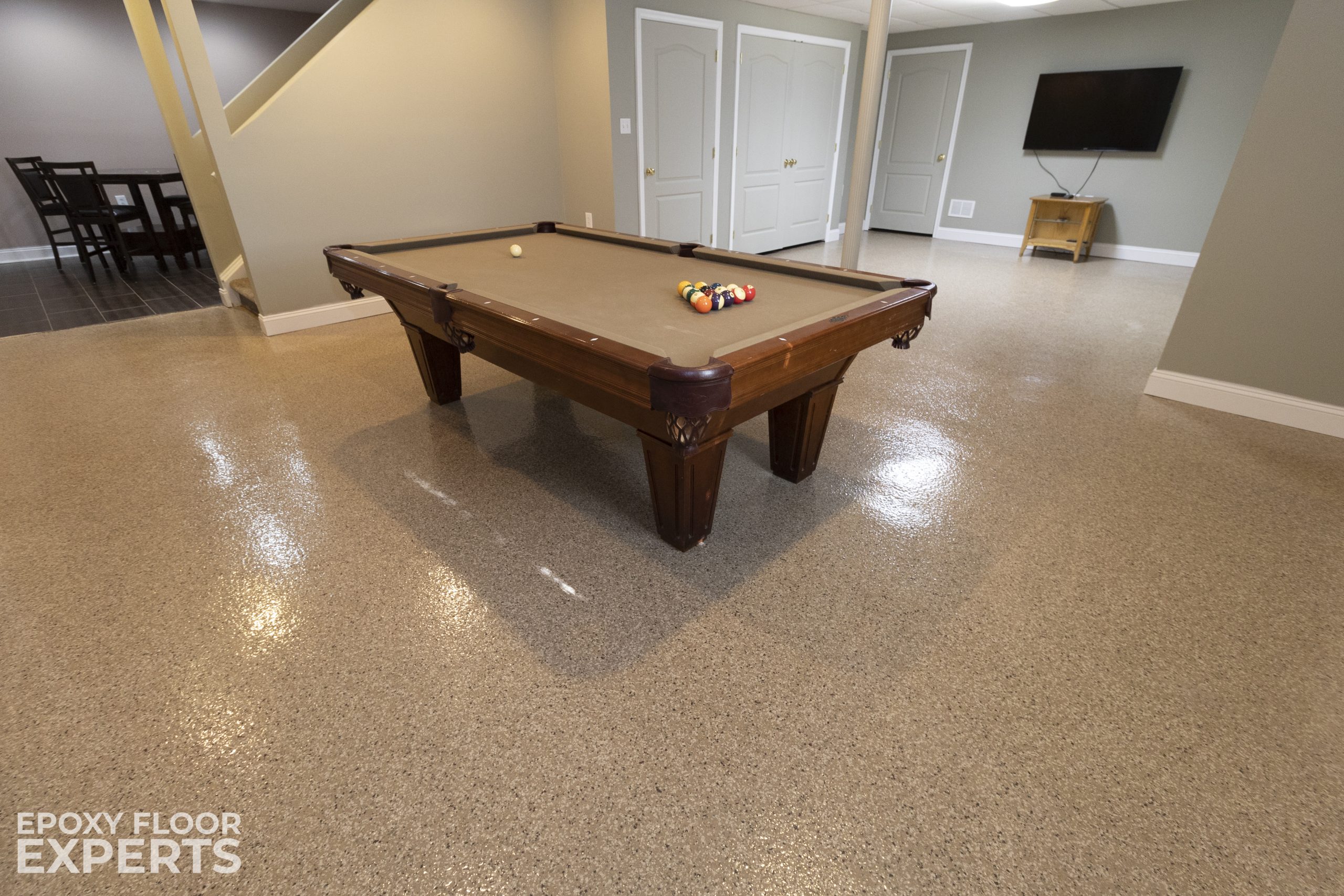 Pool table on durable epoxy flooring